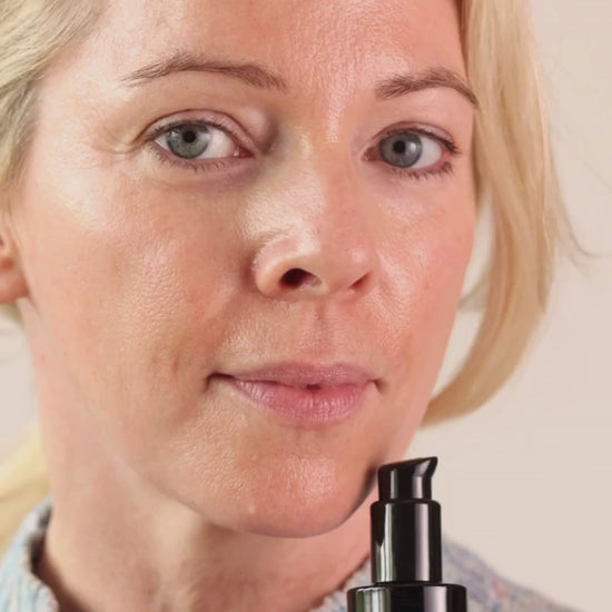 Model Holding Catalyst bottle and dropping some into hand